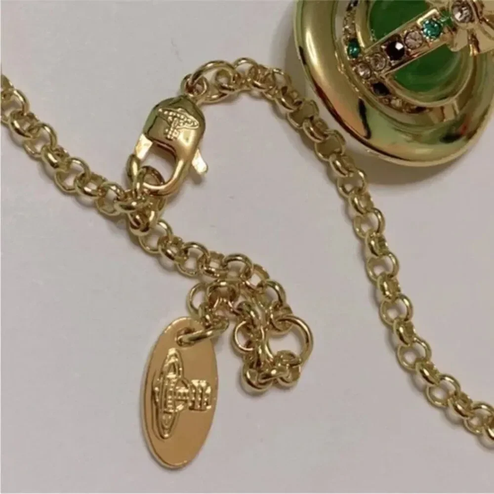 NIB Vivienne Westwood gold petite Saturn orb green crystal chain necklace
